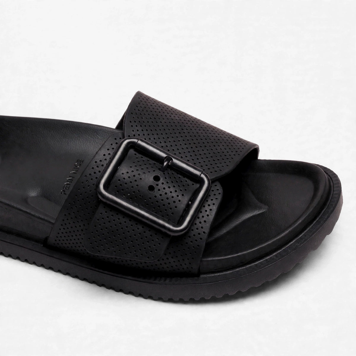 Black perforated buckle strap close-up detail