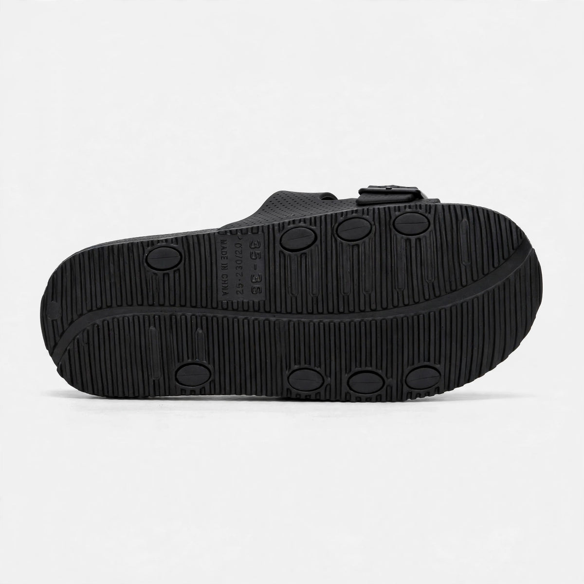 Black buckle slide sandal outsole, bottom sole view