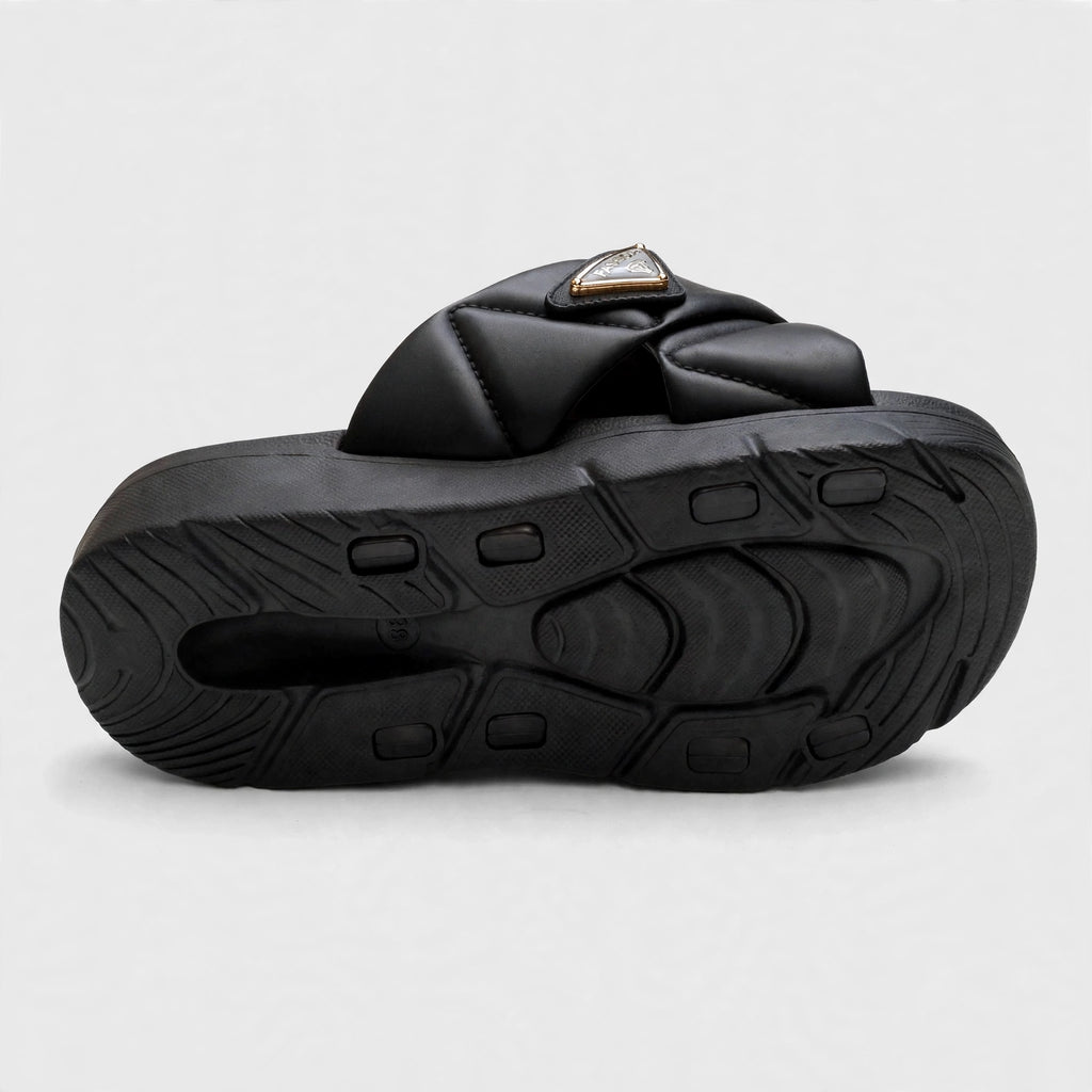 Black slide sandal outsole, bottom tread view