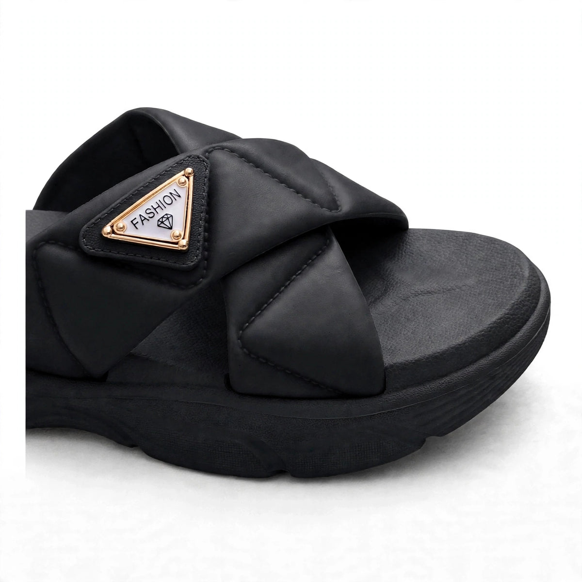 Black slide sandal buckle strap close-up