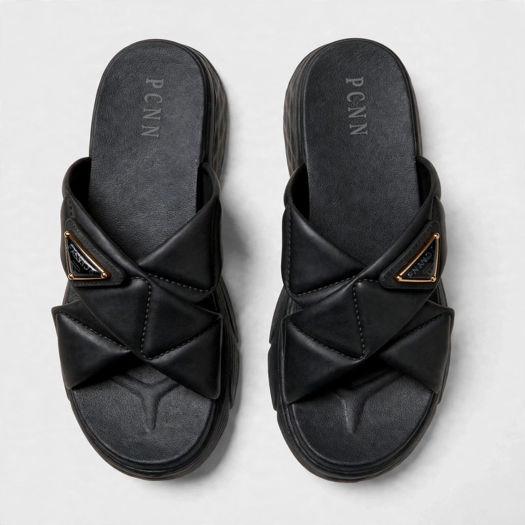 Black slide sandals, top-down view of both slides