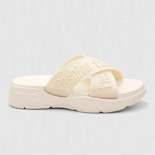 Ivory slide sandal with adjustable buckle strap, side view