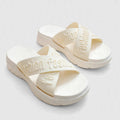 Danchi women's ivory slide sandals, pair front view