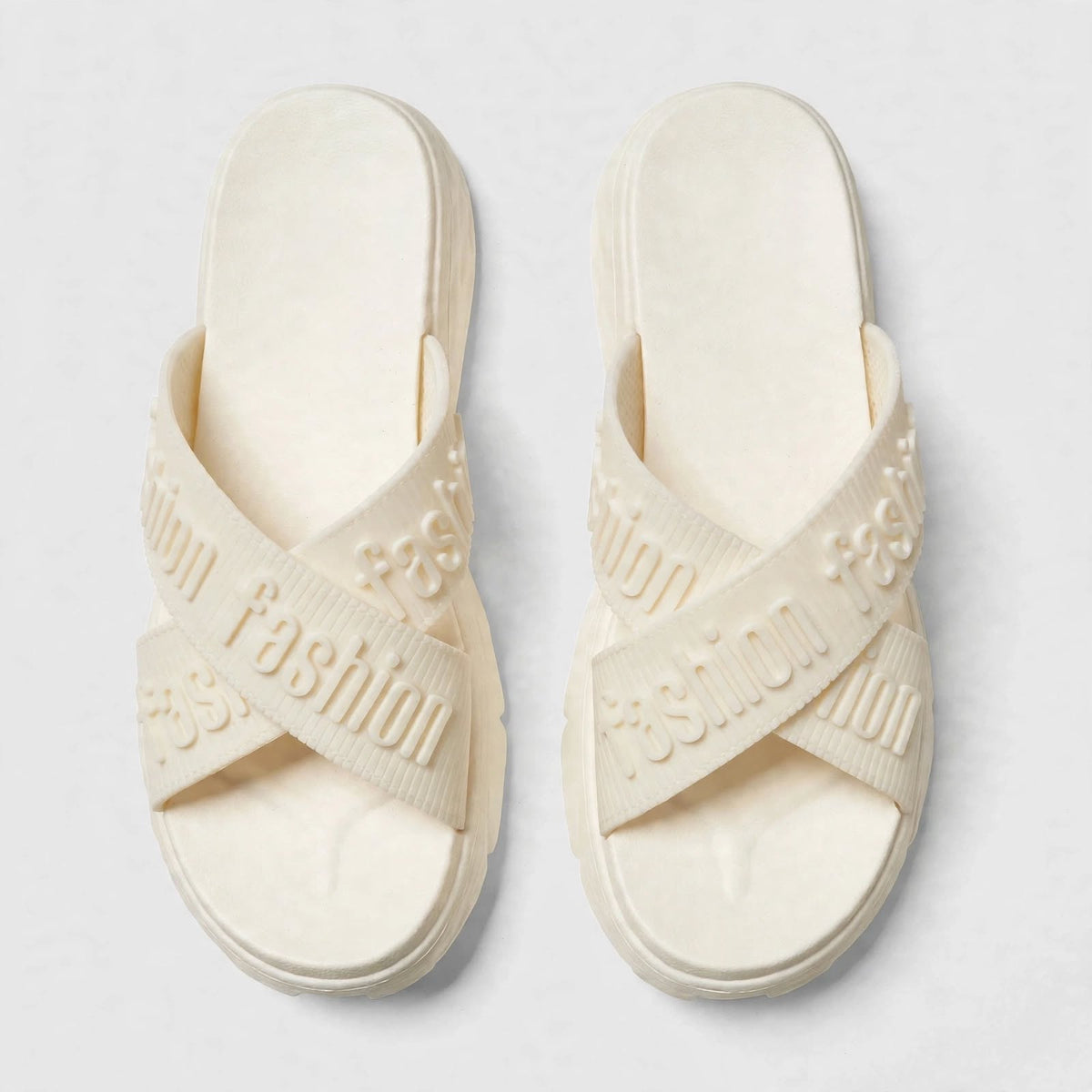 Ivory slide sandals, top-down view of both slides