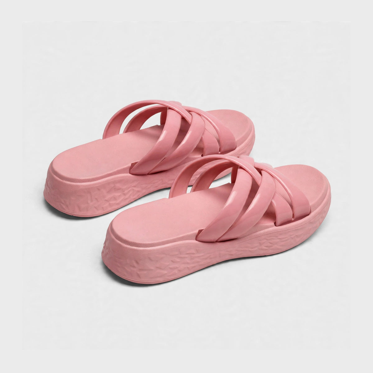 Dusty rose slide sandals, angled studio view