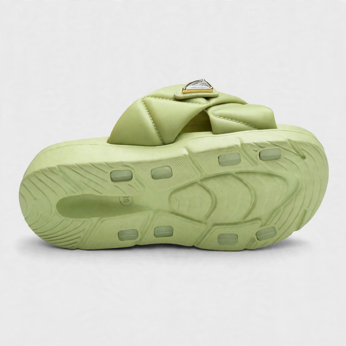 Green slide sandal outsole, bottom tread view