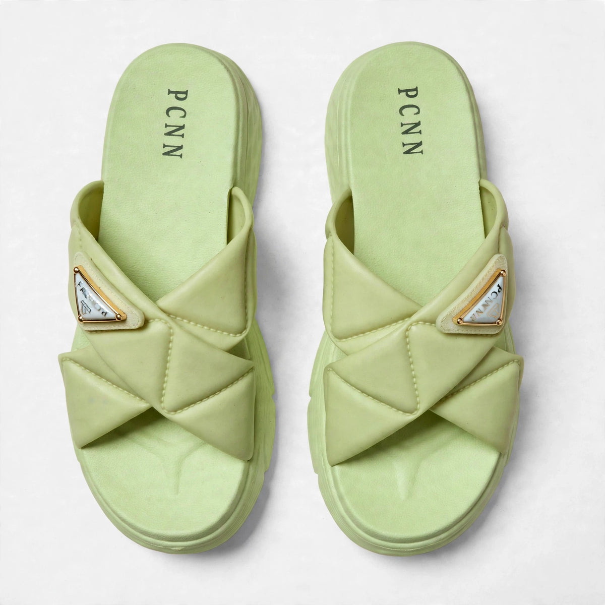 Green slide sandals, top-down view of both slides
