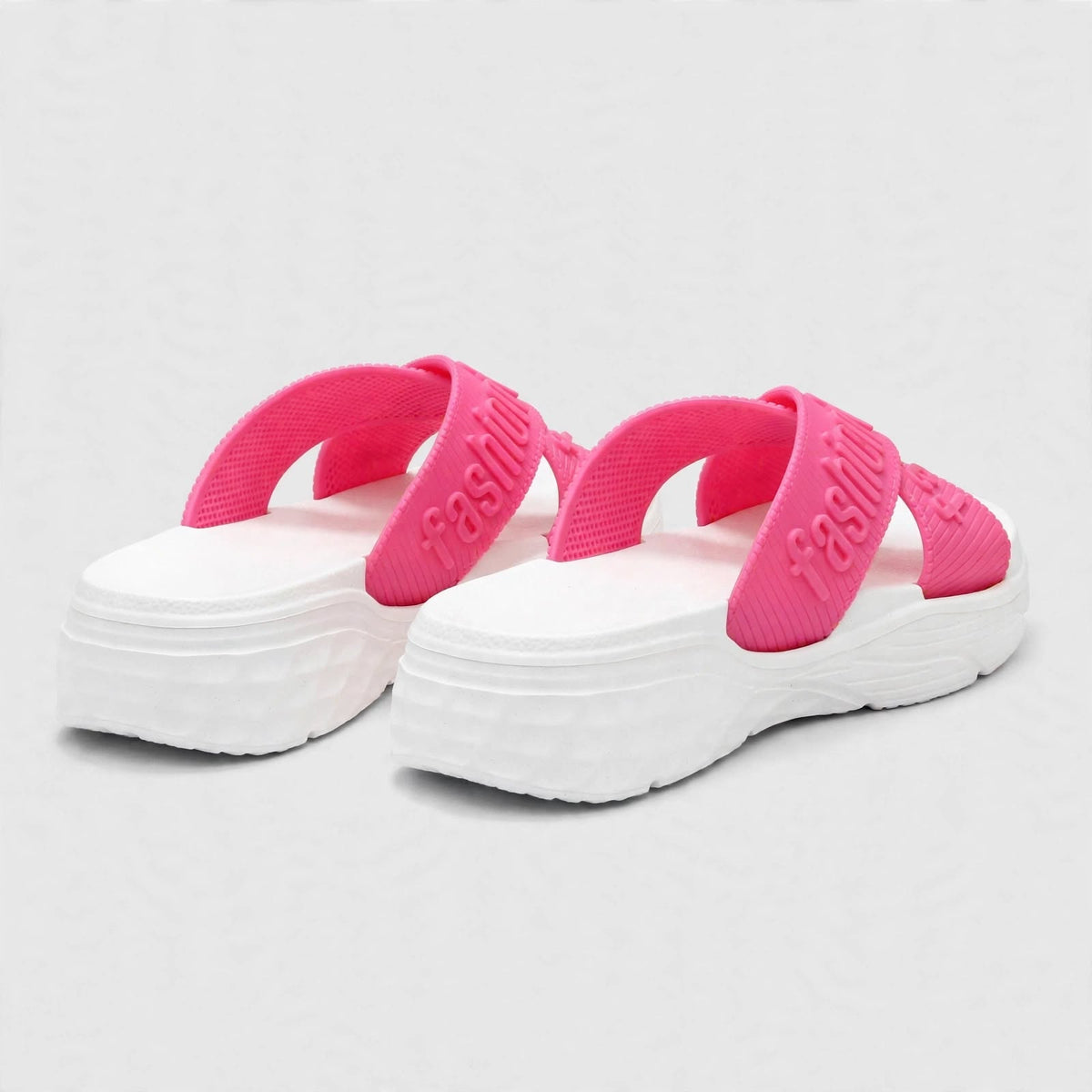 Pink platform slide sandals, angled view