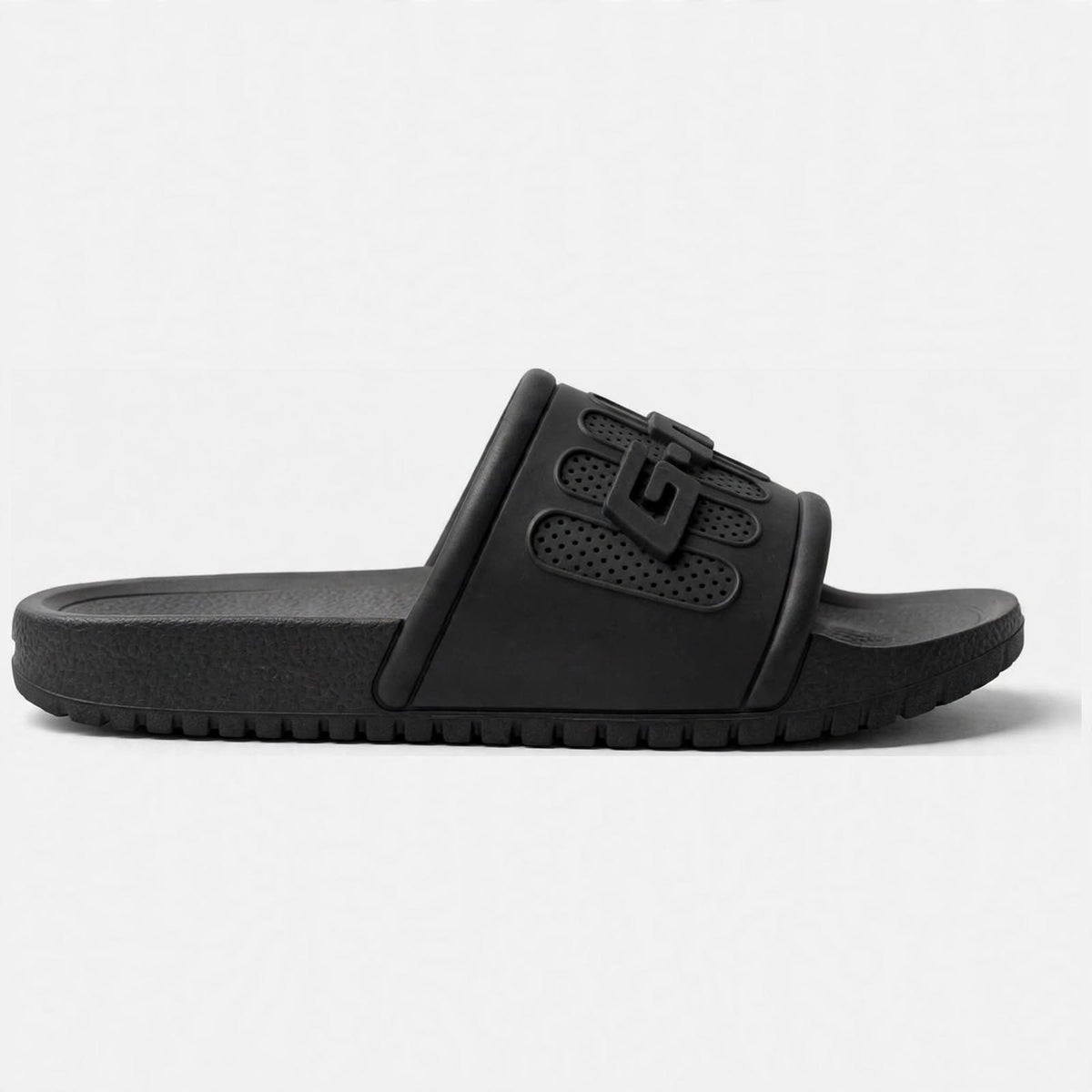 Matte black slide sandal buckle strap close-up