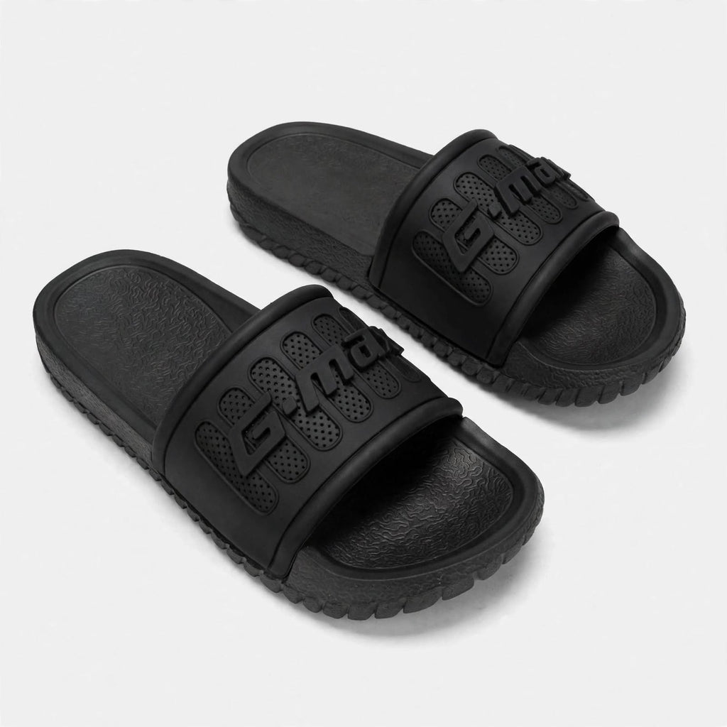 Matte black slide sandals, pair front view