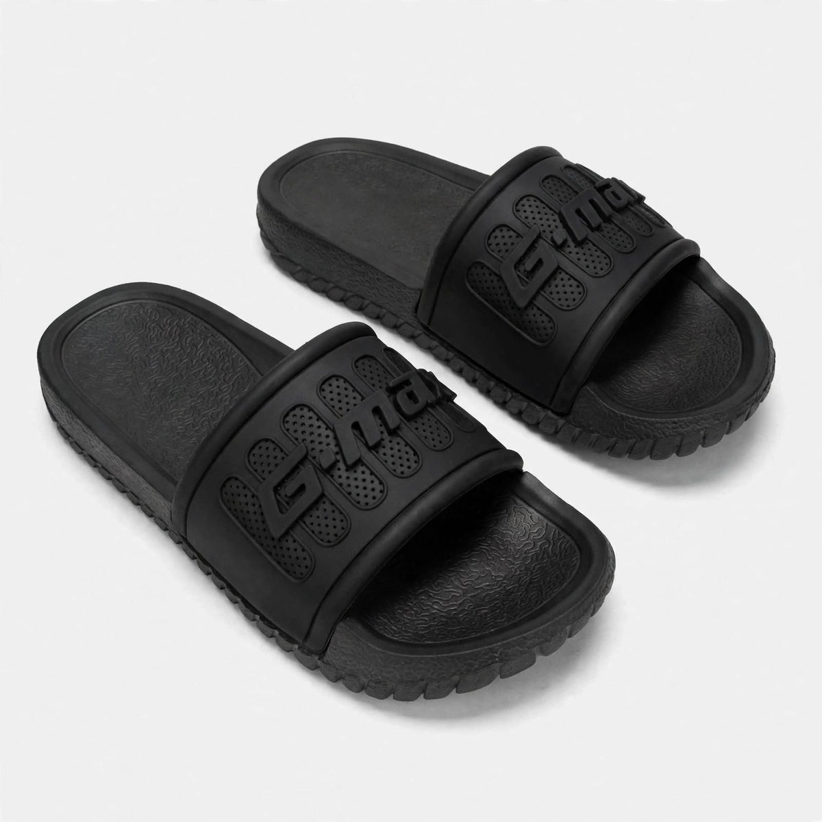 Matte black slide sandals, pair front view