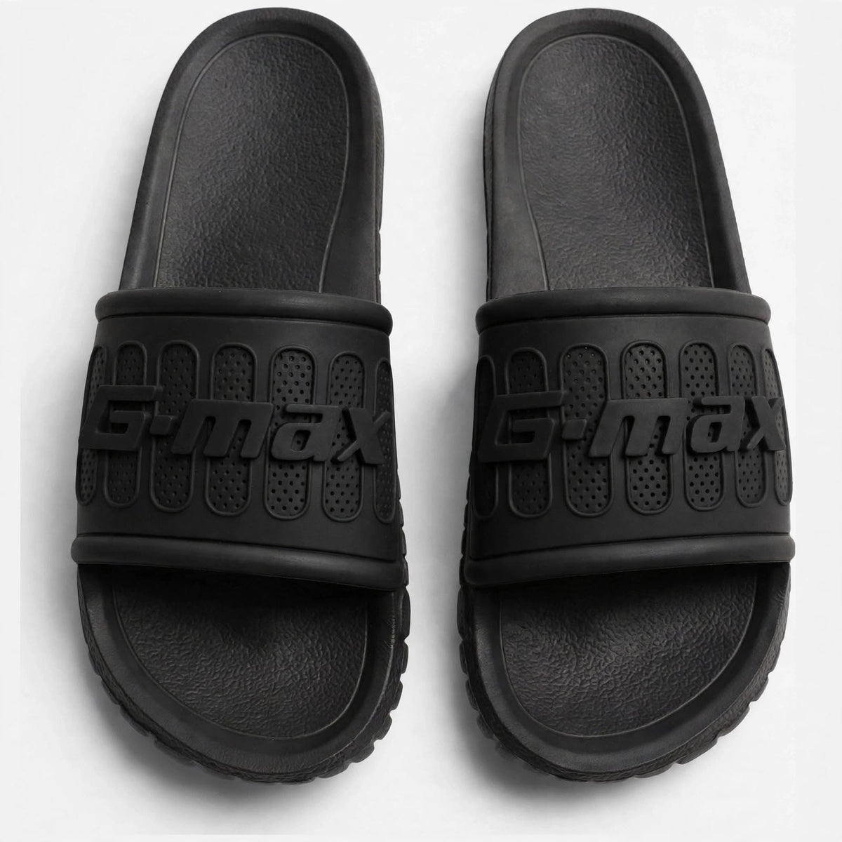 Matte black slide sandals, top-down view of both slides