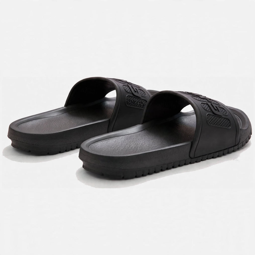 Matte black slide sandals, angled pair view