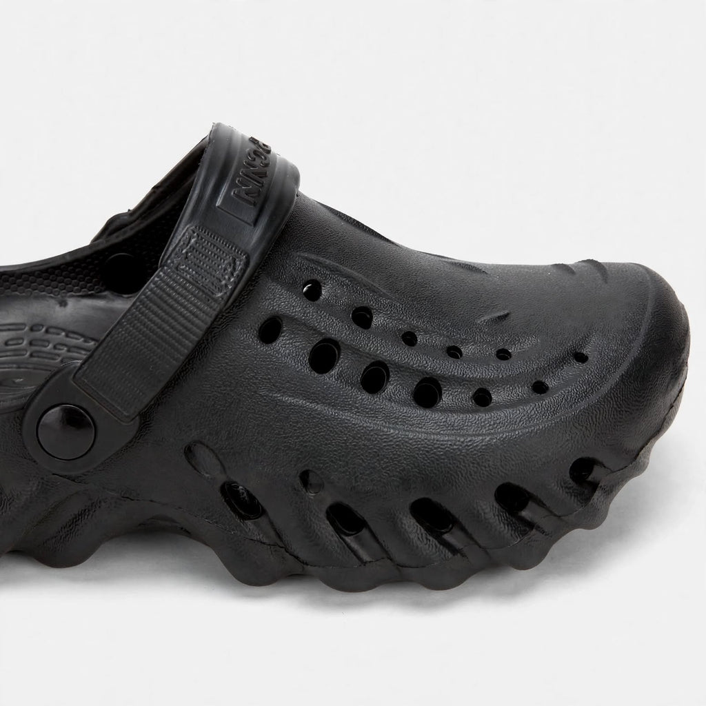Men's black clog - close-up studio shot of material