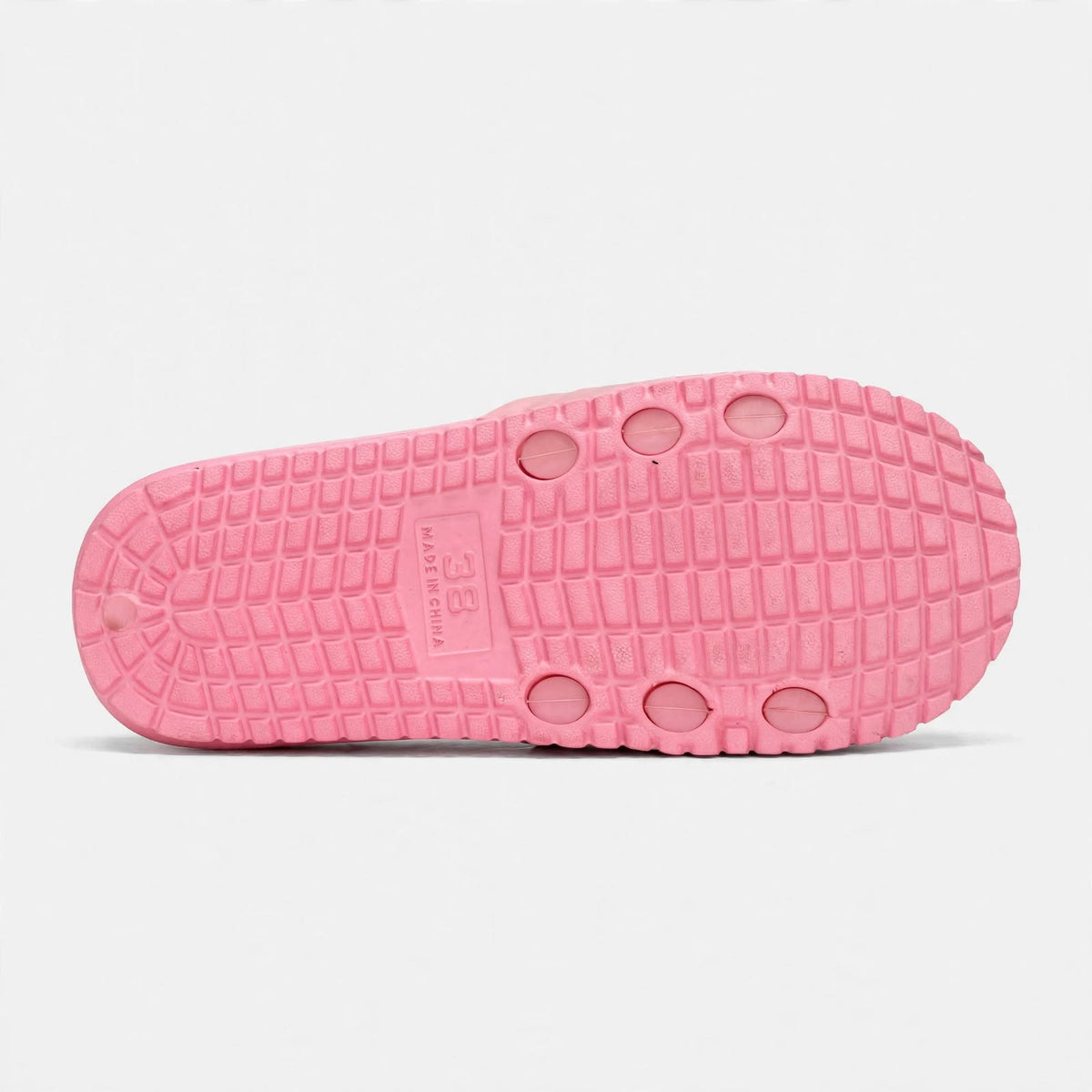 Soft pink slide sandal outsole, bottom tread view
