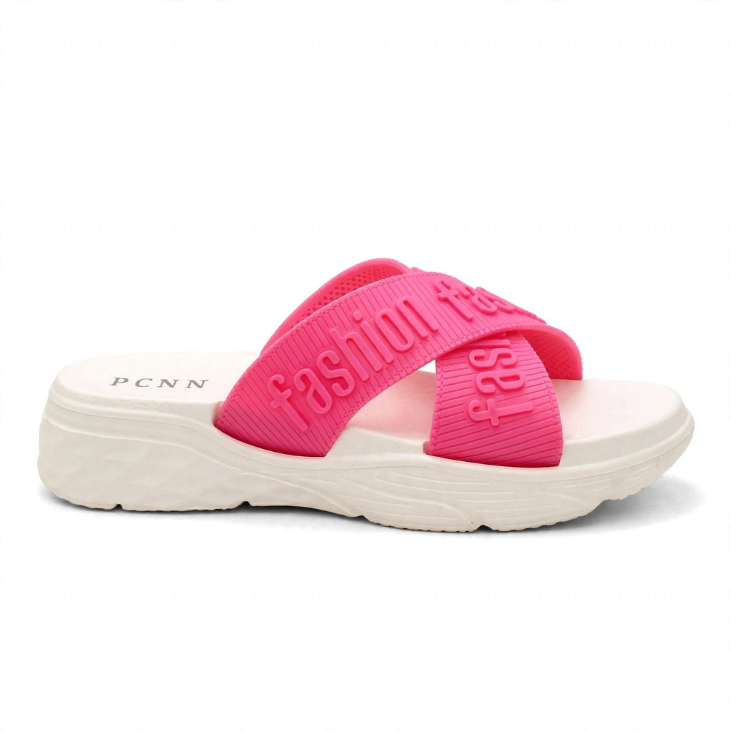 Pink slide sandal with white sole, studio side view